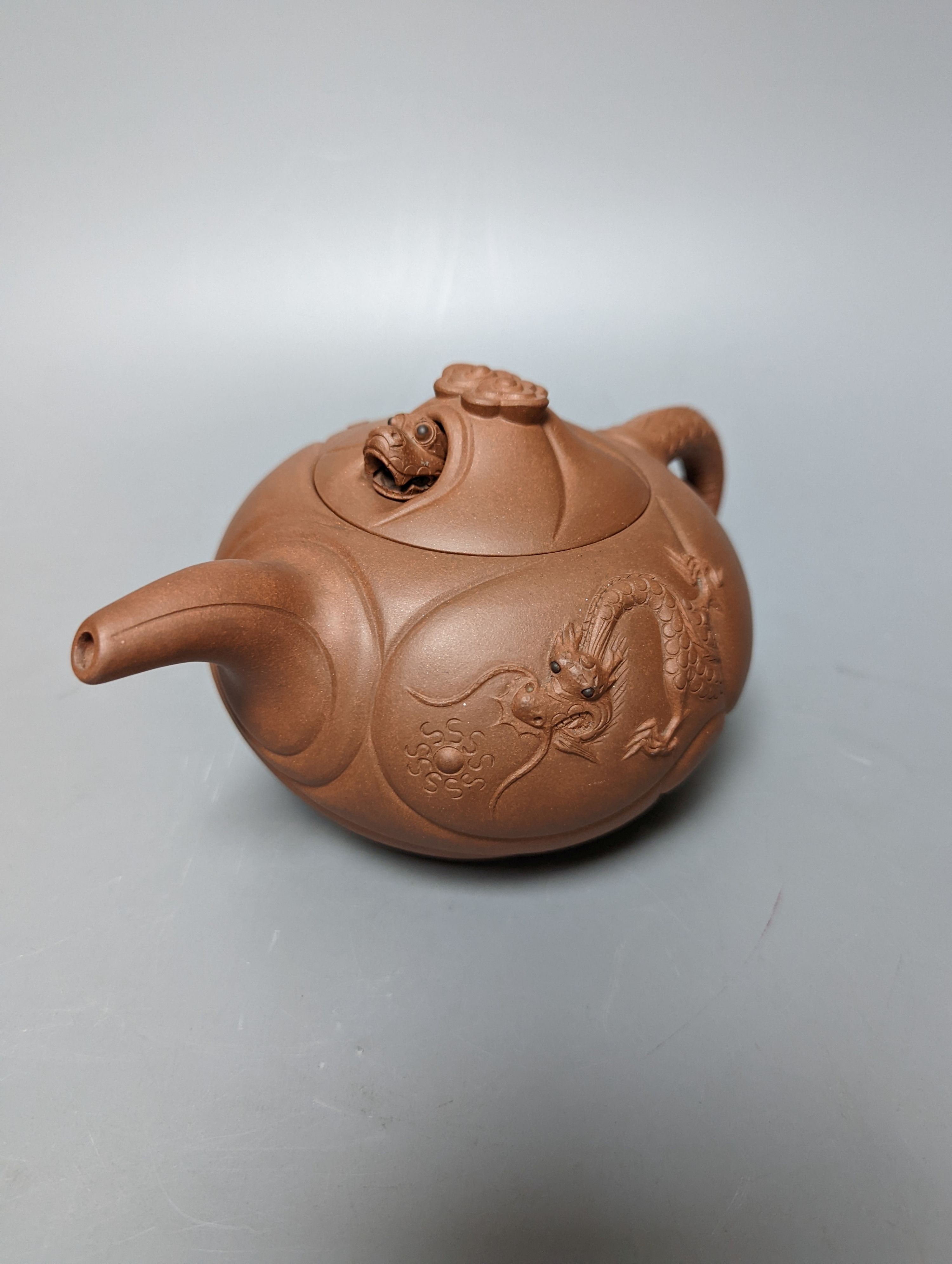 Three Chinese Yixing teapots and a carved soapstone teapot tallest 12cm